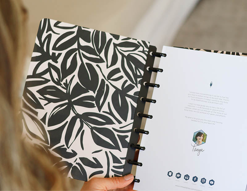 An RY25 InkWELL Press planner opened to Tanya's intro letter on insert.
