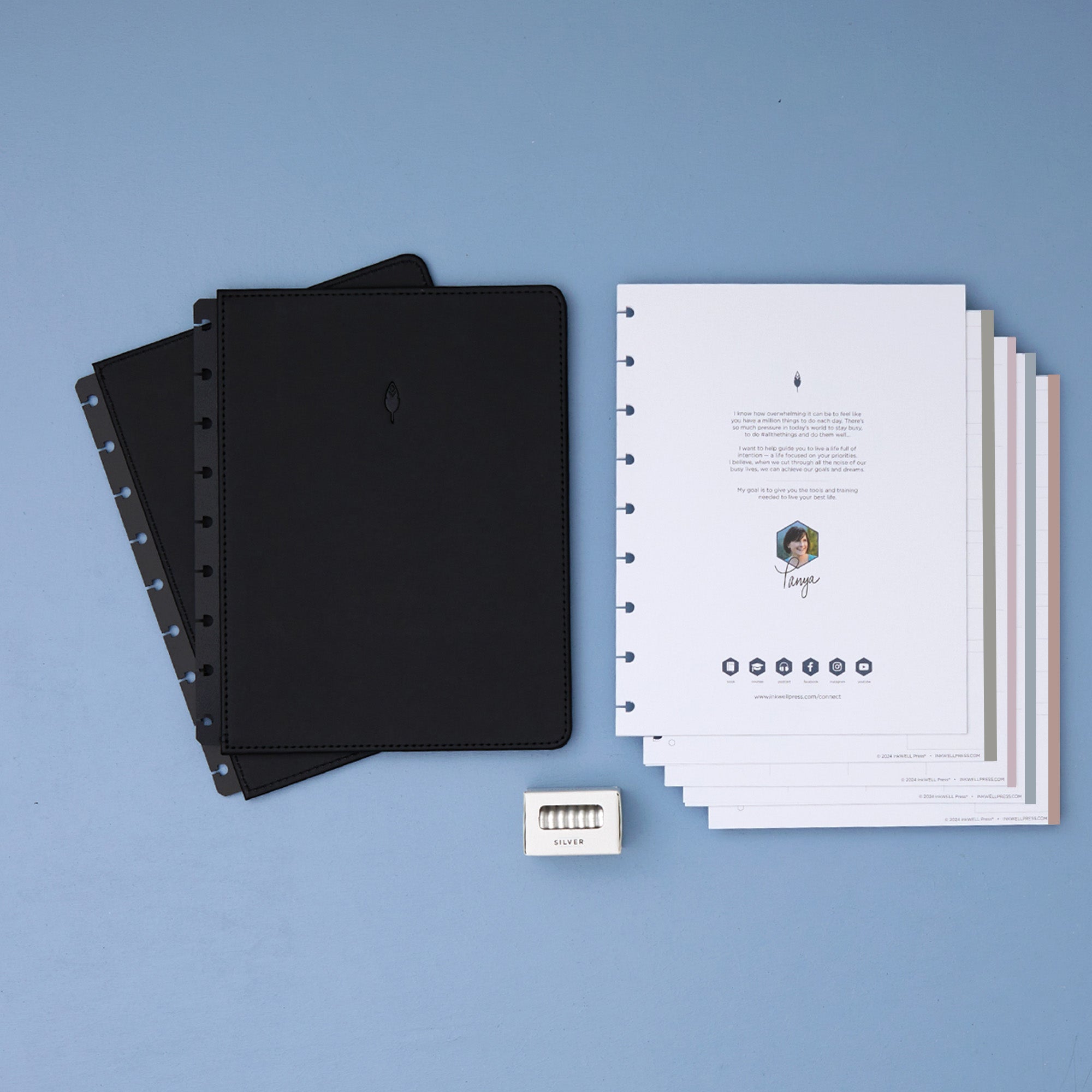 2026 planner in 7x9 size featuring black cover, silver discs, and monthly planning monthly layout