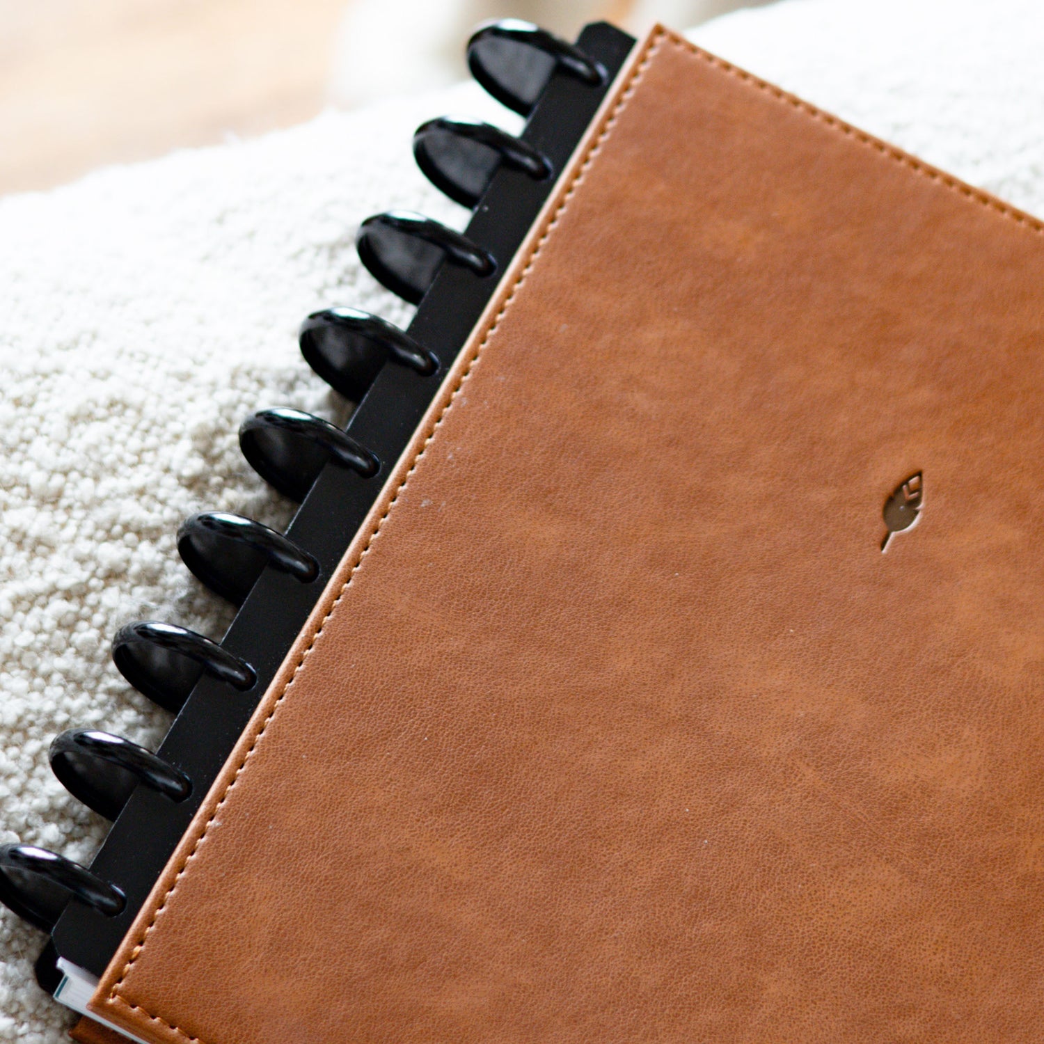 Black discs on a saddle faux leather cover