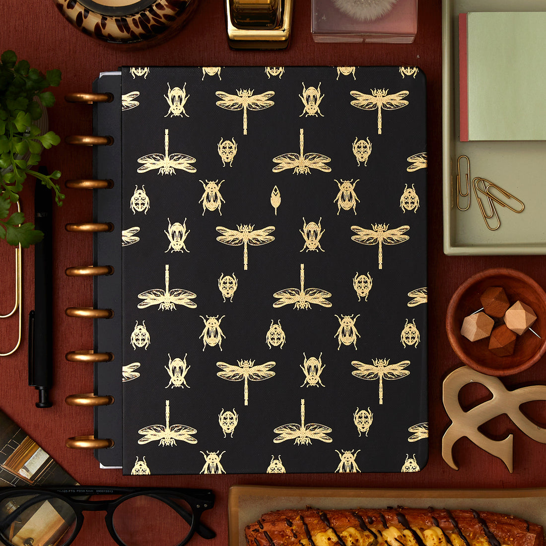 7x9 cover with gold foil beetles and fireflies on a black background. 