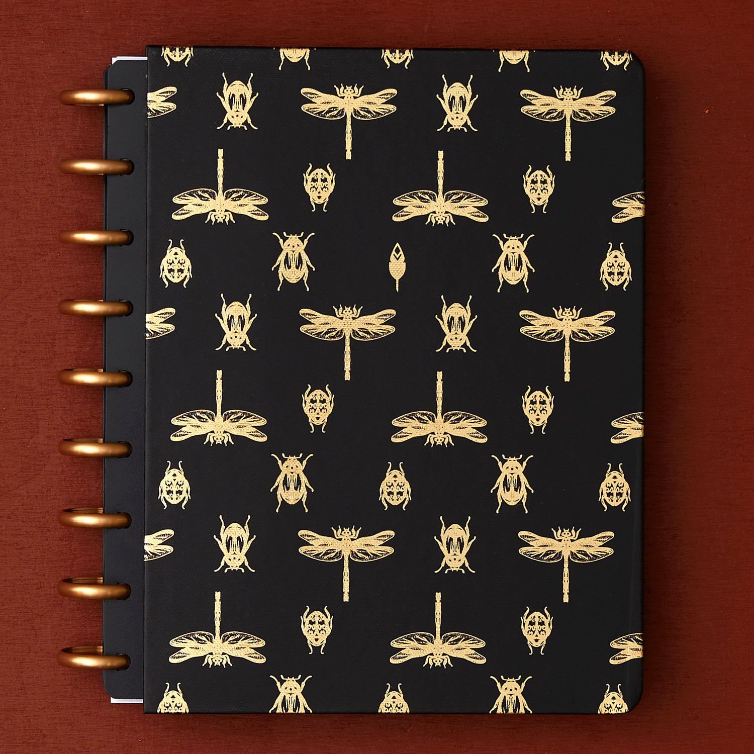 7x9 cover with gold foil beetles and fireflies on a black background. 