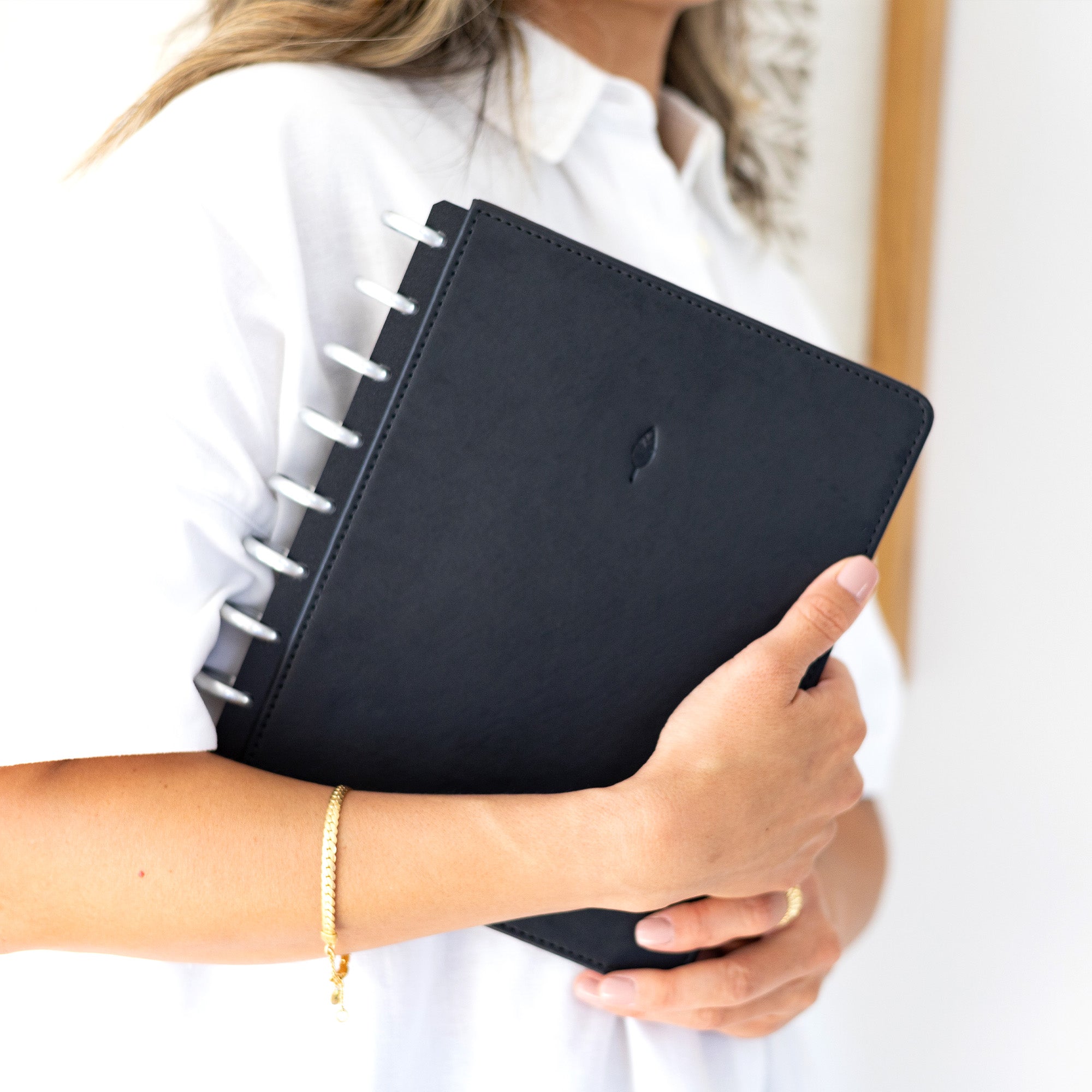 silver disc bound planner with classic inserts and black cover