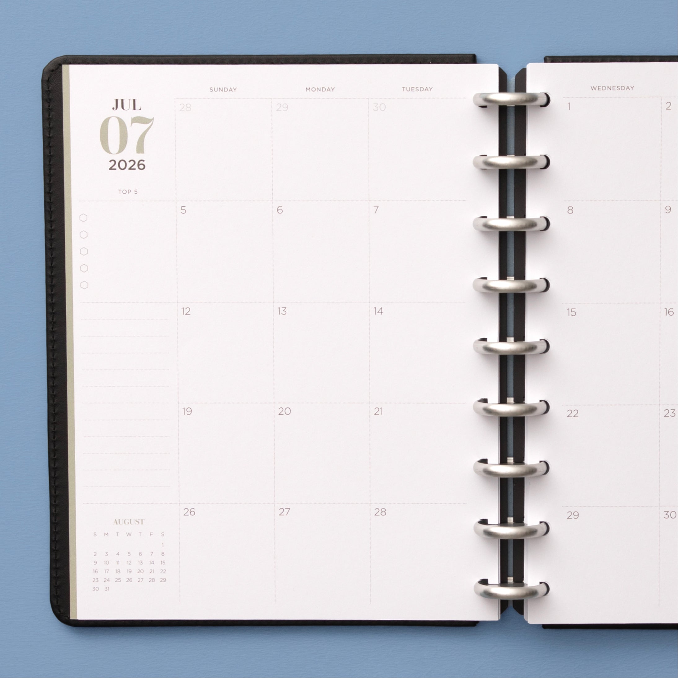 monthly spread featuring open writing space, bullet points, lined notes section for this 7x9 planner