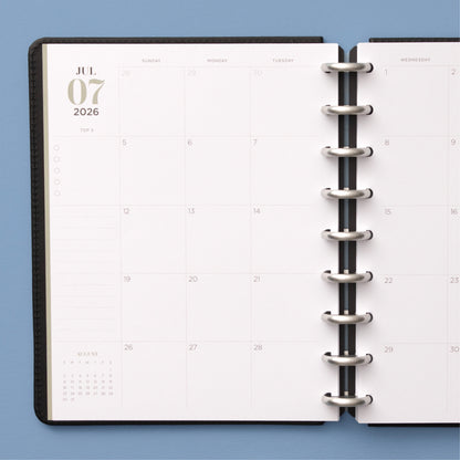 monthly spread featuring open writing space, bullet points, lined notes section for this 7x9 planner