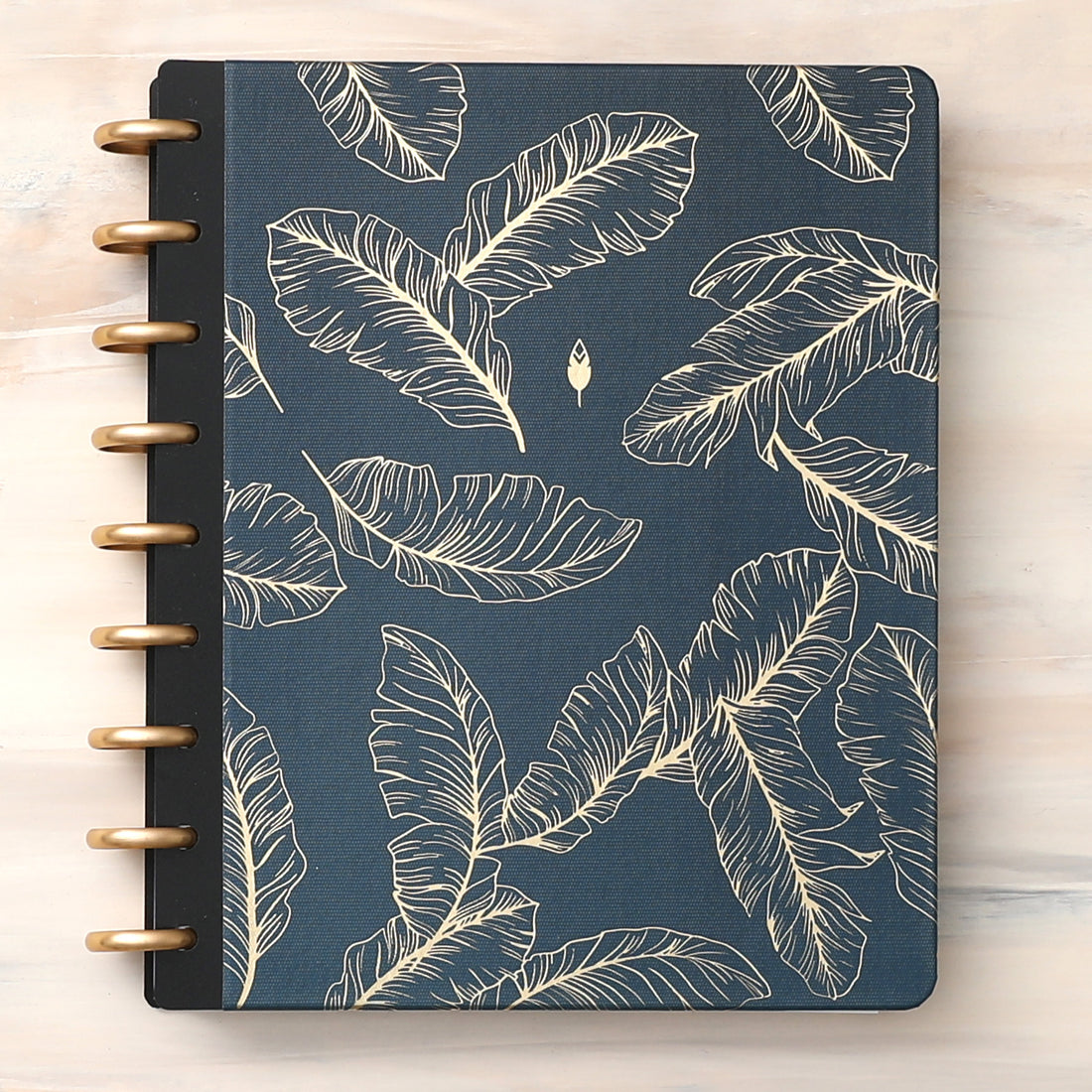 golden embossed quills on a dark blue/green back ground cover for this inkwell press planner