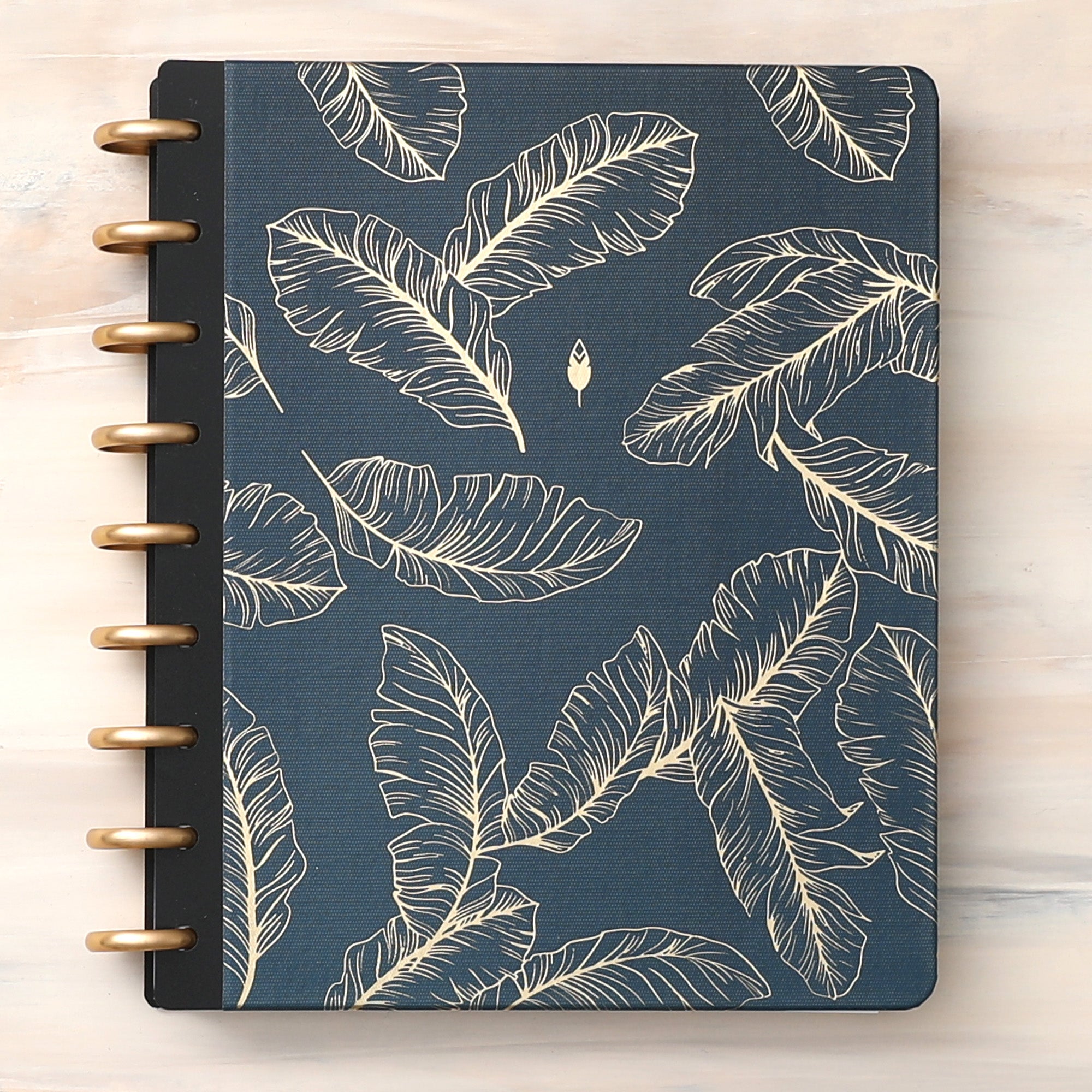 golden embossed quills on a dark blue/green back ground cover for this inkwell press planner