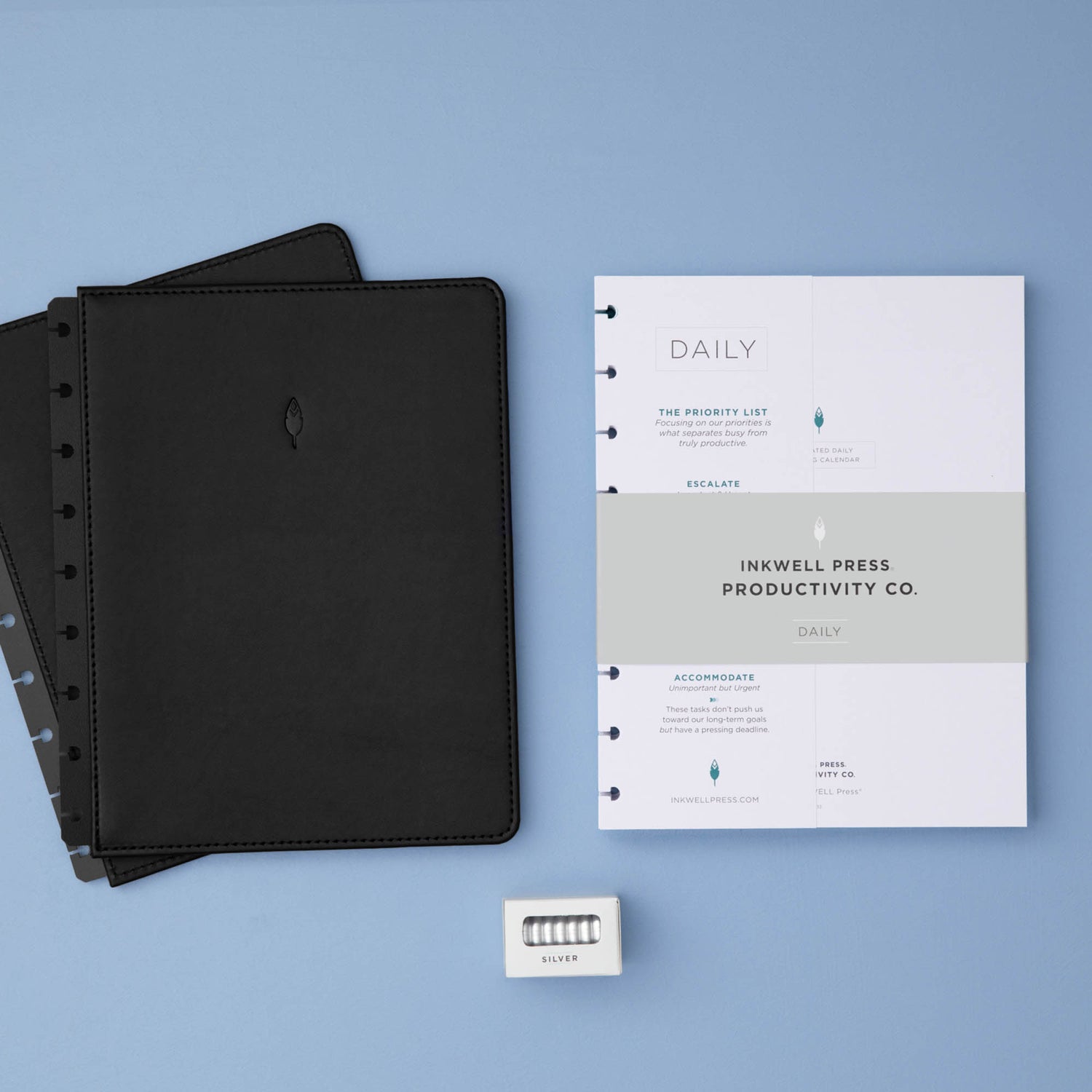 planner bundle featuring a non-dated daily insert in 7x9 size with black faux leather cover and silver discs