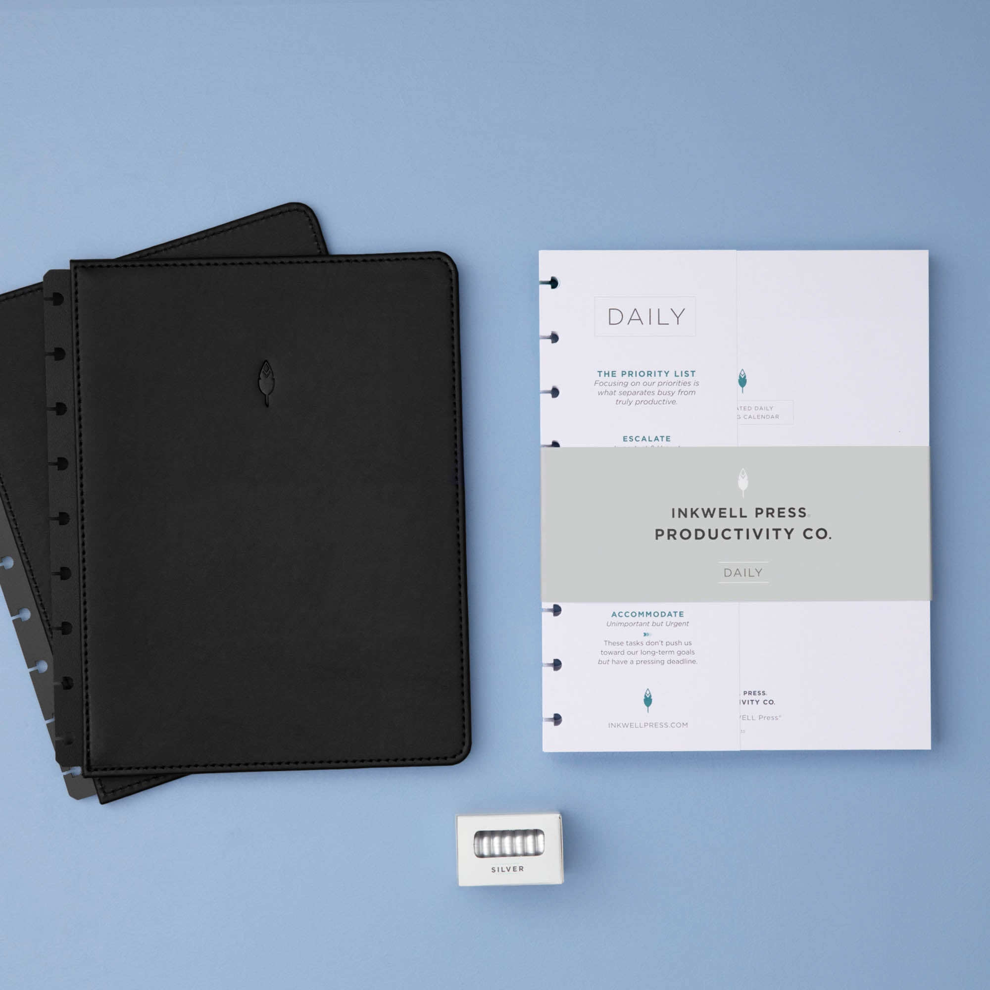 planner bundle featuring a non-dated daily insert in 7x9 size with black faux leather cover and silver discs