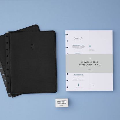 planner bundle featuring a non-dated daily insert in 7x9 size with black faux leather cover and silver discs