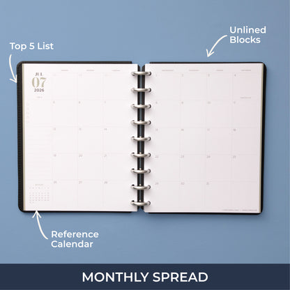 monthly spread featuring open writing space, bullet points, lined notes section for this 7x9 planner