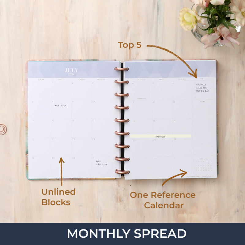 2024-2025 monthly planner featuring a monthly spread with top 5 to do's, lined notes, daily blocks and reference calendars.