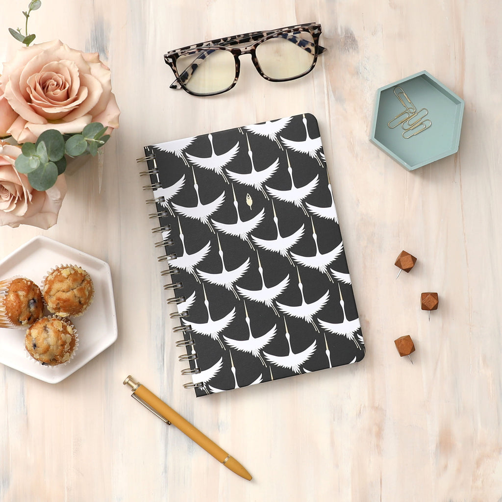 high quality lined and gridded notebook with gold twin wire o and front cover featuring flying swans 