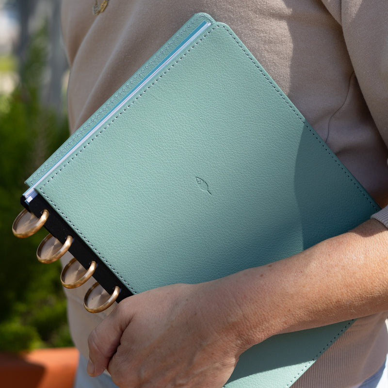 Vegan leather cover in a rio green for your inkwell press planner featuring gold discs.