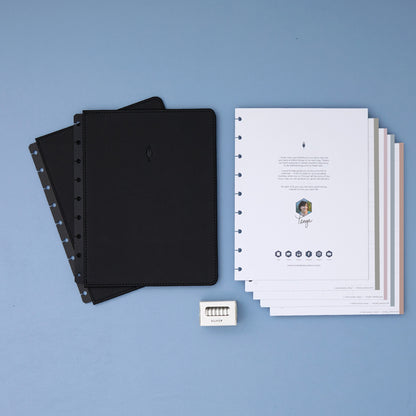 2026 planner in 7x9 size featuring black cover, silver discs, and flex horizontal planning weekly layout