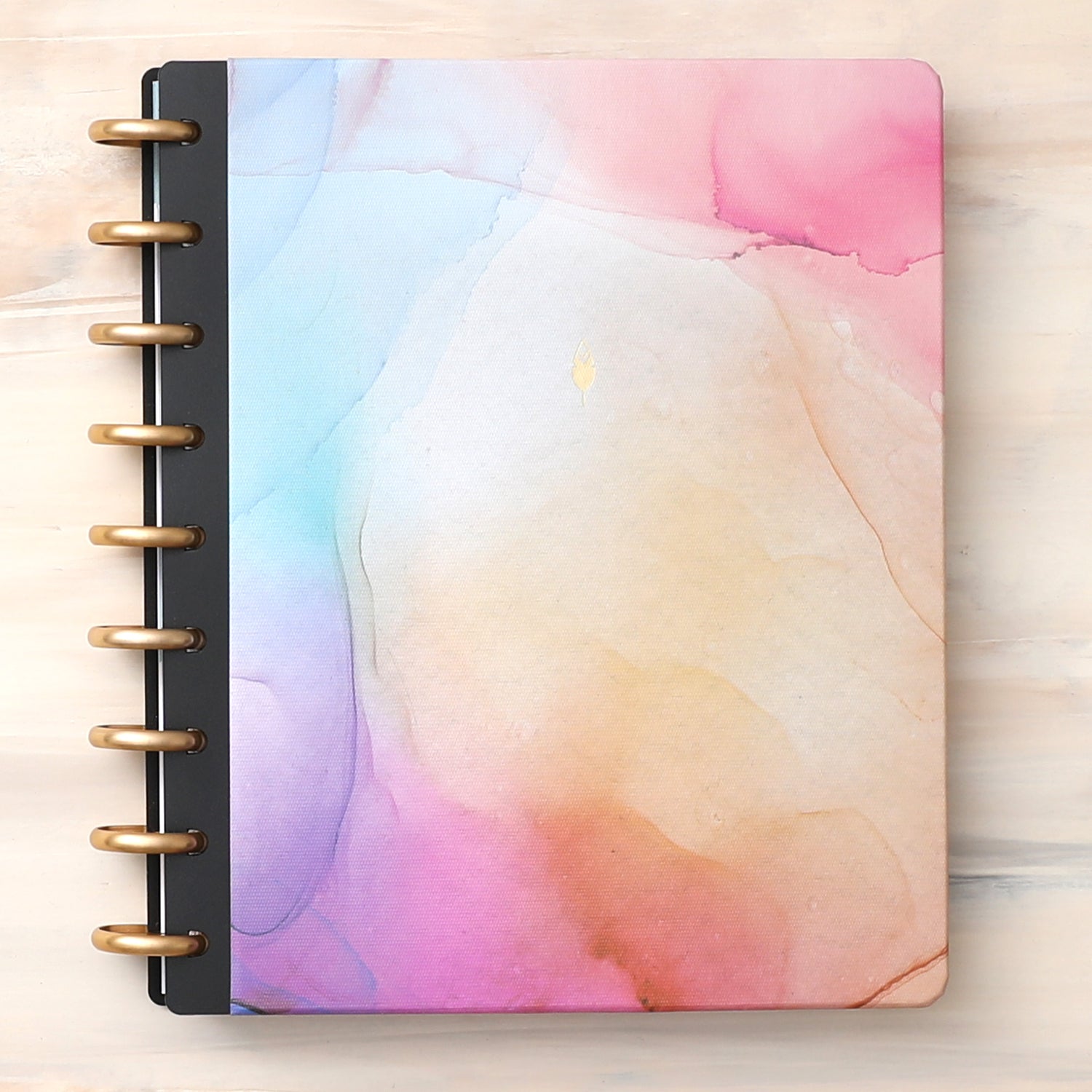 This beautiful 7x9 hardcover for your custom inkwell planner features a marble like design with hues of pink, blue, purple, and coral.