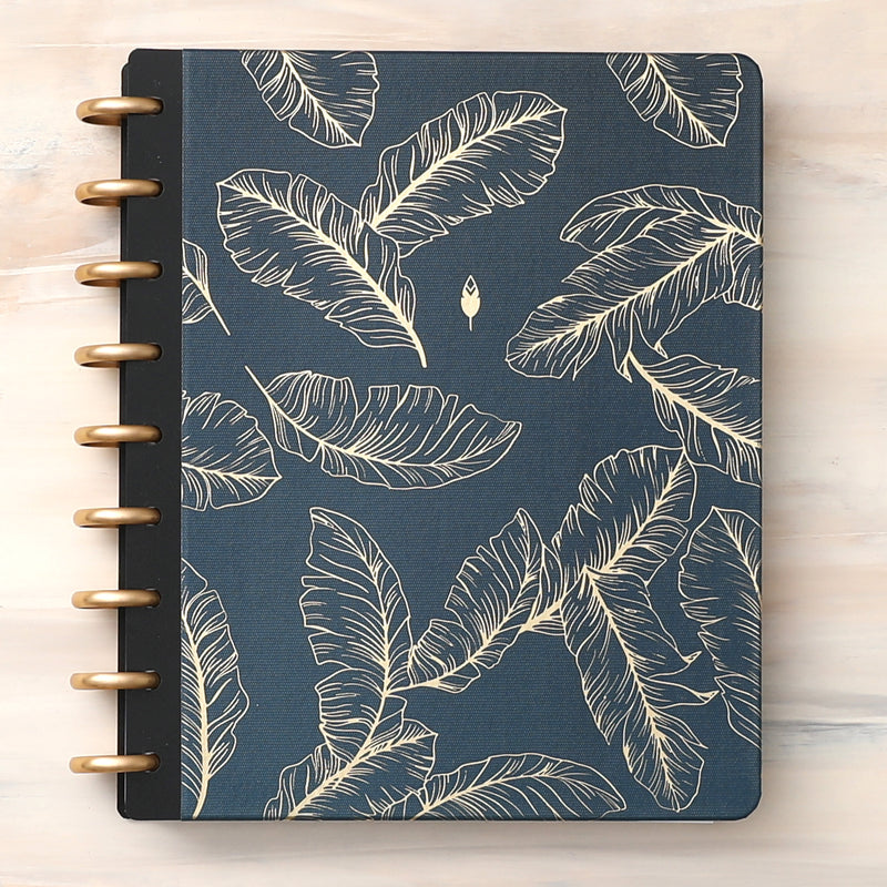 This beautiful classic and signature hard cover features a spread of quill feathers sitting calmly on a navy background