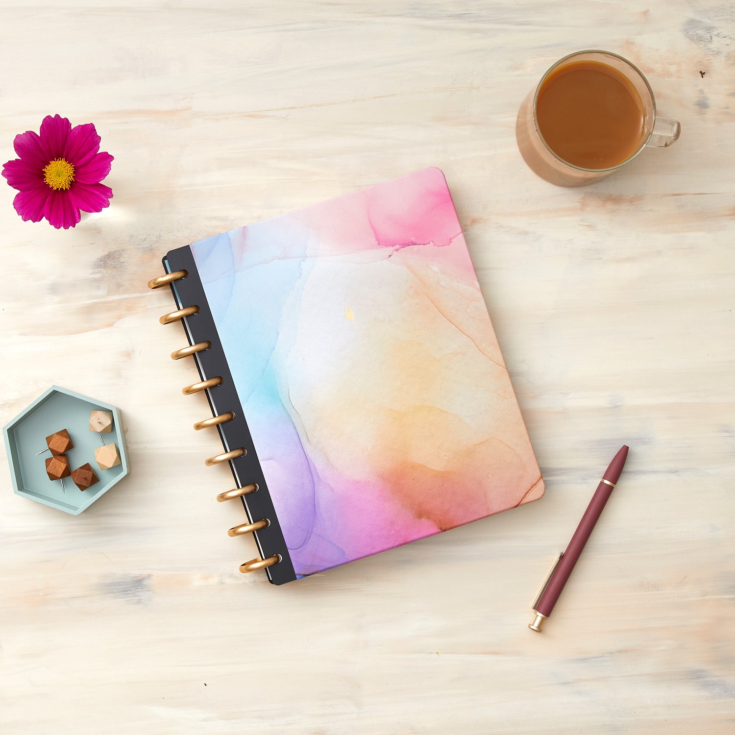 This beautiful 7x9 hardcover for your custom inkwell planner features a marble like design with hues of pink, blue, purple, and coral.