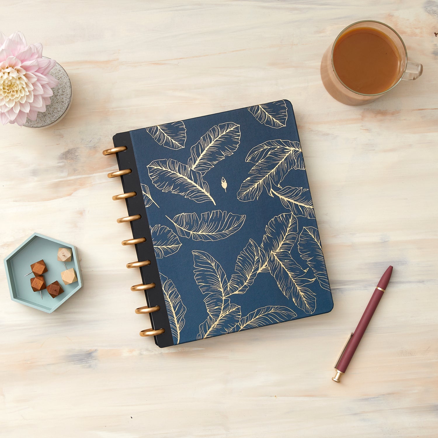 This beautiful classic and signature hard cover features a spread of quill feathers sitting calmly on a navy background