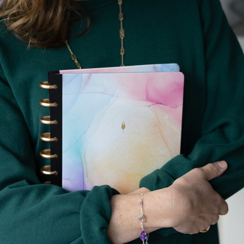 This beautiful 7x9 hardcover for your custom inkwell planner features a marble like design with hues of pink, blue, purple, and coral.